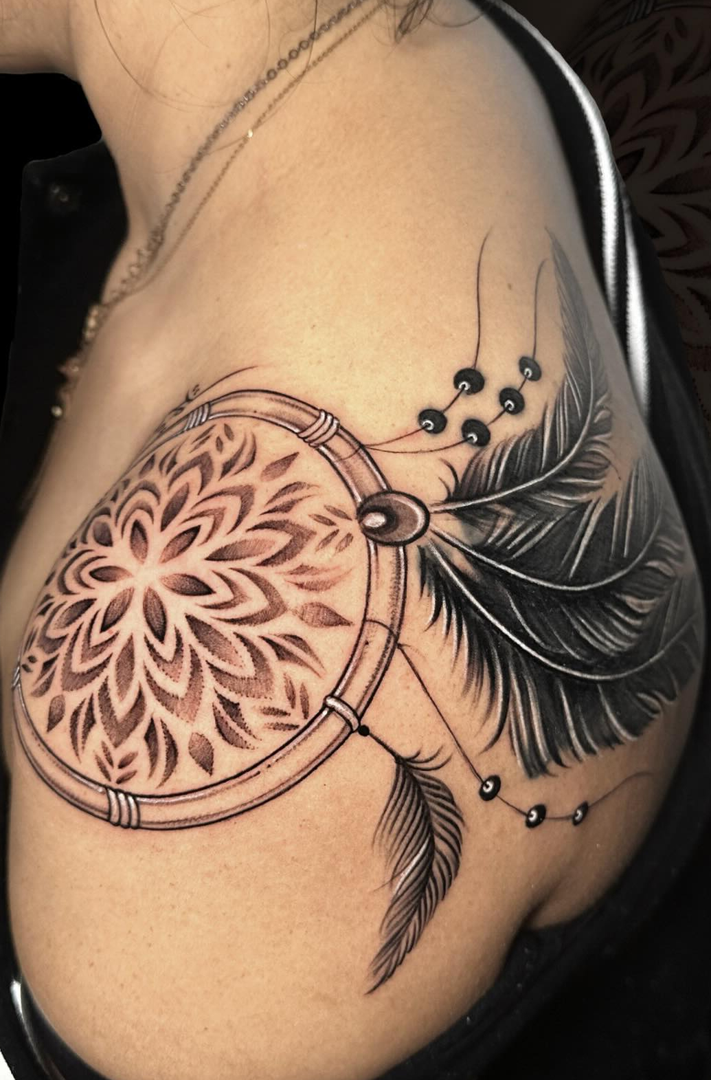 Feather mandala tattoo